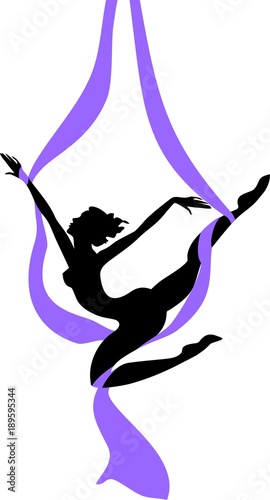 Silhouette of female dancer on purple aerial silk