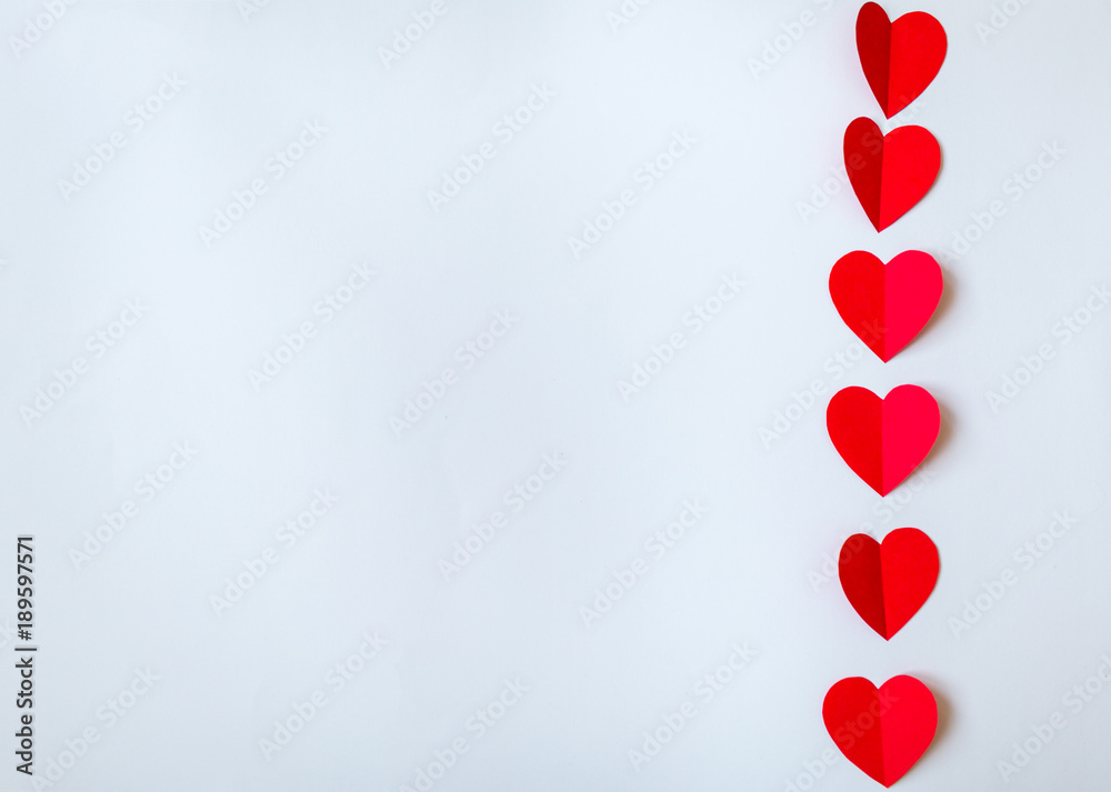 Valentine day background with red hearts, top view. White background with copy space.