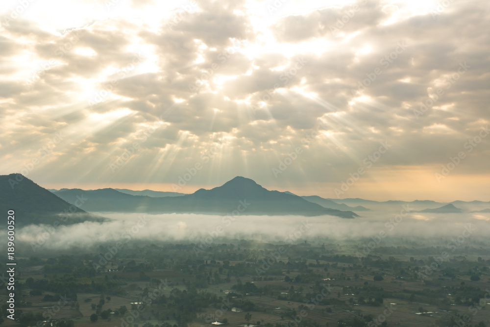 Mountain landscape with sky, sun with light, clouds and beautiful mist,Phu Tho Chiang Khan,Loei.