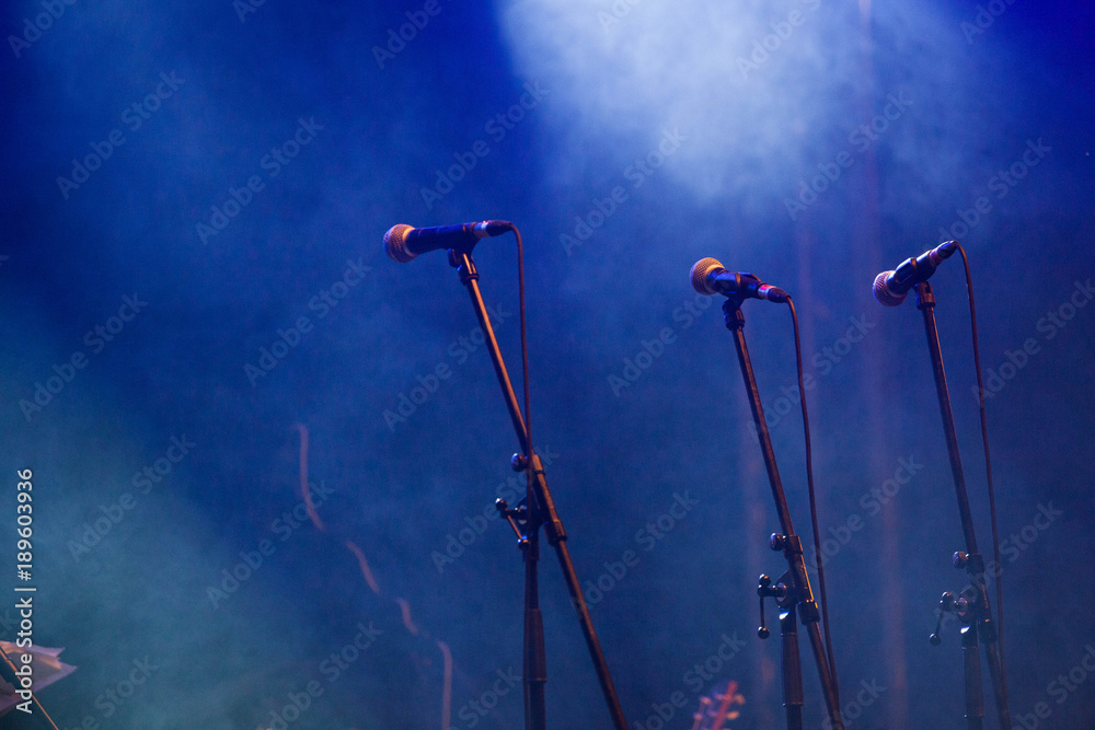 microphones standing on the stage - concert