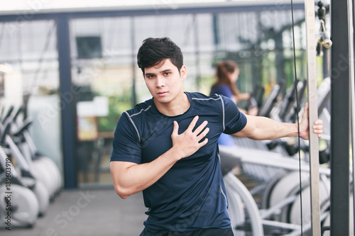 man exercising in fitness gym for good health.