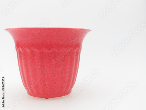 Empty plastic pink plant pot with dotted and stripped isolated on white background