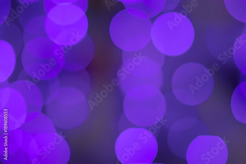 Photo of purple bokeh in the city at night. Effect light texture and design. Soft focus and blur background.