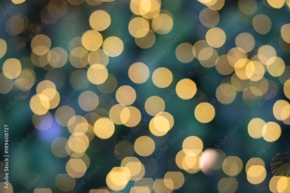 Photo of bokeh in Merry Christmas and Happy new year’s Day. Effect golden light texture and design. Soft focus and blur green background.
