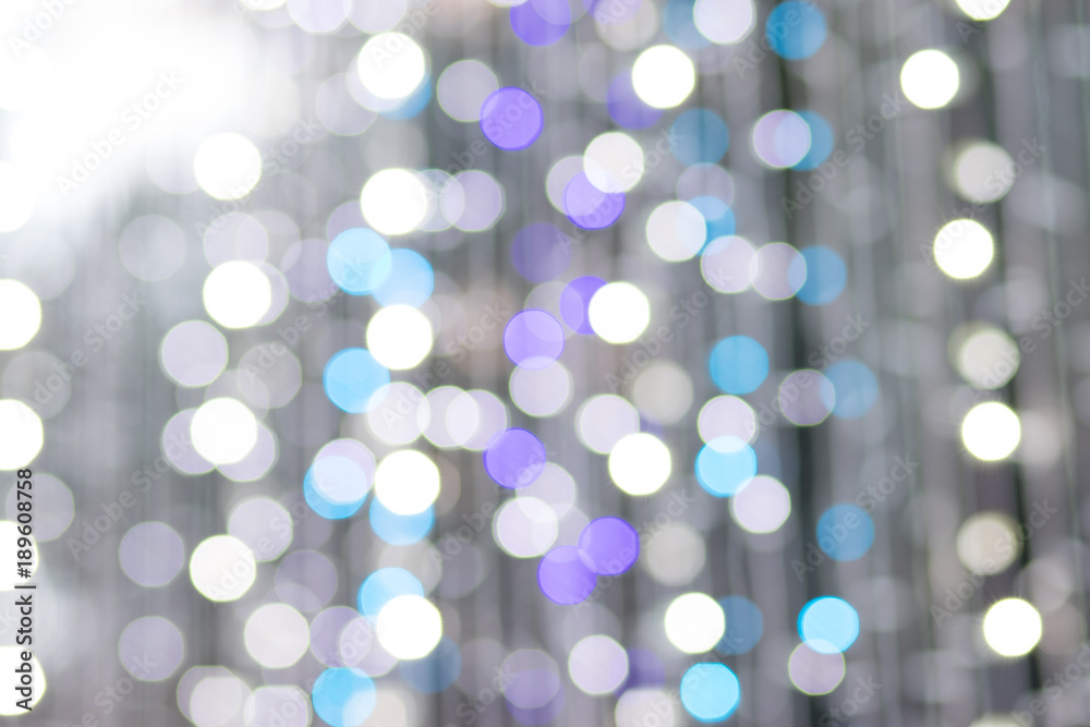 Obraz premium Photo of colorful bokeh lights in the City at night. Effect golden light texture and design. Soft focus and blur background.
