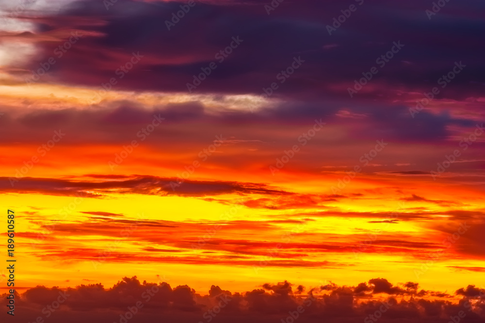 Fiery orange sunrise sky.