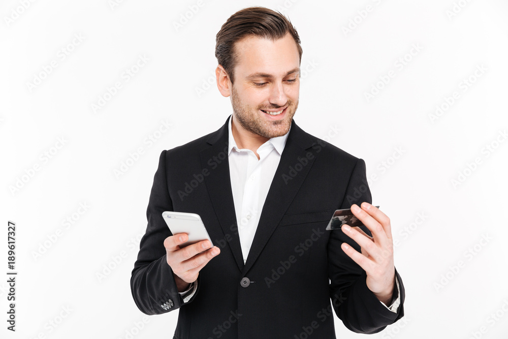 Happy young businessman standing isolated Happy young businessman standing isolated