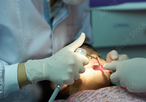 dentist use tool blow air in mouth and teeth kid for work photo