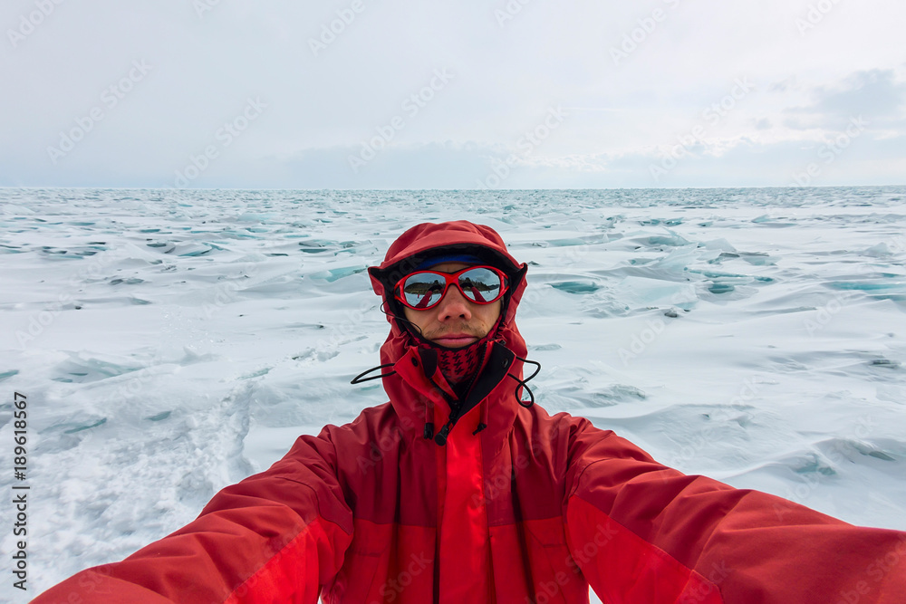 Selfie portrait of a man in a snowy Baikal in hummocks Selfie portrait of a man in a snowy Baikal in hummocks