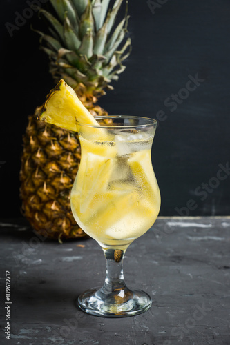 Sweet cocktail with pineapple and rum. Selective focus.