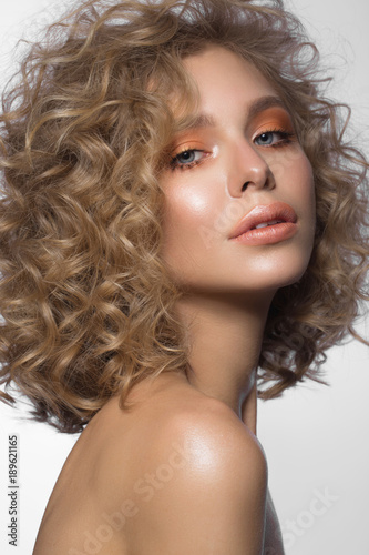 Canvas Print Beautiful blonde girl with curls and gentle make-up