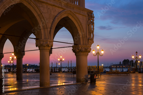Famous Doge palace, column with winged lion and San Marco square at sunrise in Venice, Italy © Shchipkova Elena