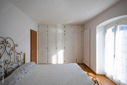 Master bedroom with doilies cover photo