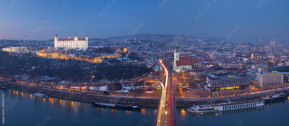 Bratislava - Panoramic skyline of the City from SNP Bridge at dusk.