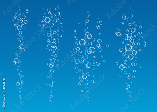  Underwater fizzing air bubbles  stream on blue   background.