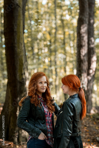 Red-haired sisters enjoying a walk