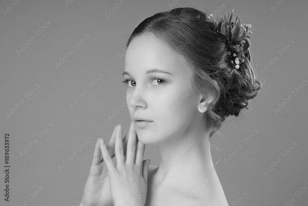 1000px x 669px - The girl with the hair bun and Nude make-up holding hands in prayer on the  gray isolate black and white image Stock Photo | Adobe Stock