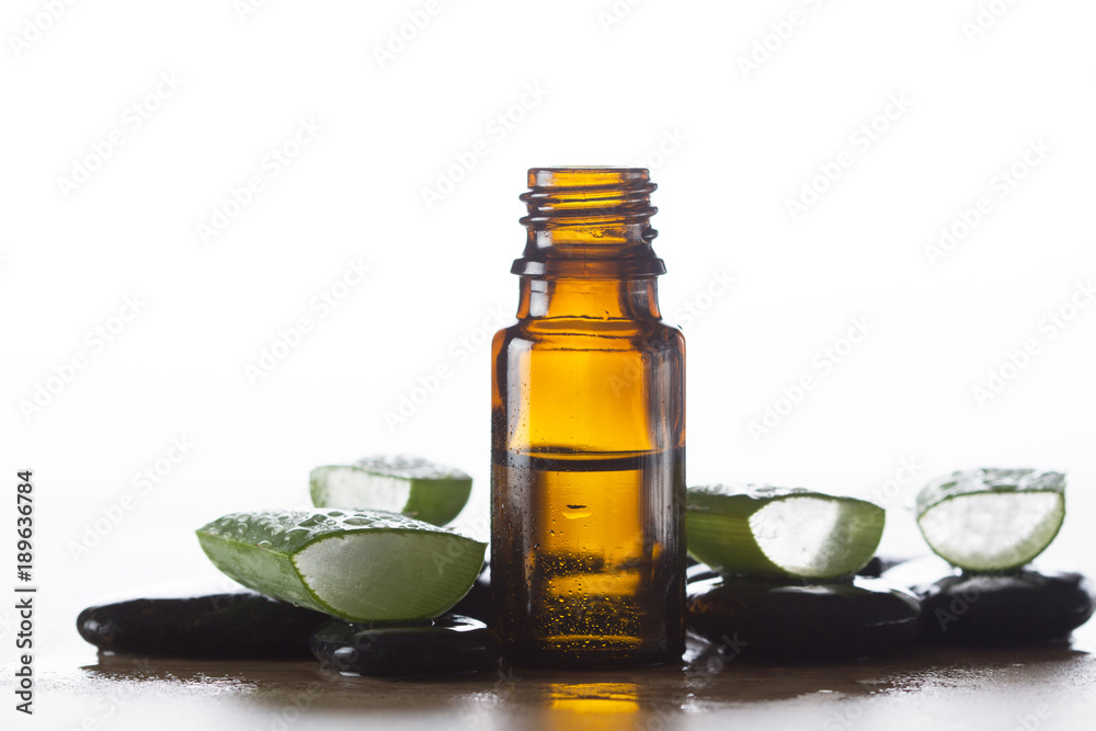 Essential oil for aromatherapy, stones and fresh aloe vera Essential oil for aromatherapy, stones and fresh aloe vera