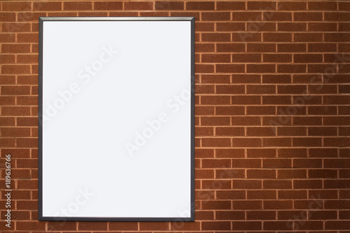 blank advertising poster billboard on brick wall