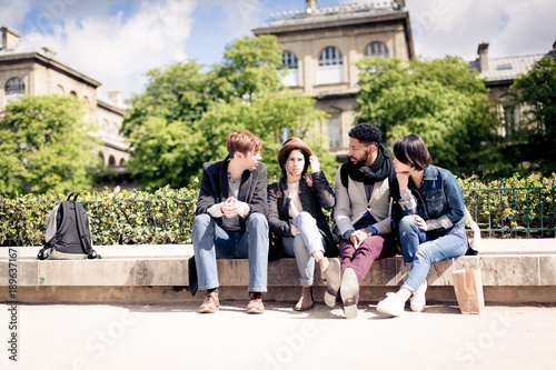 Multi-ethnic Group Of Friends Having Fun In Paris, Notre Dame