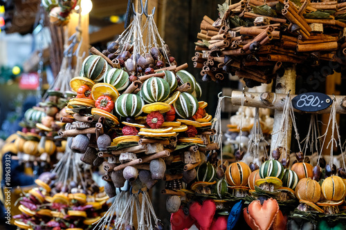 Traditional dried orange and cinnamon stick Christmas decorations on a market stall