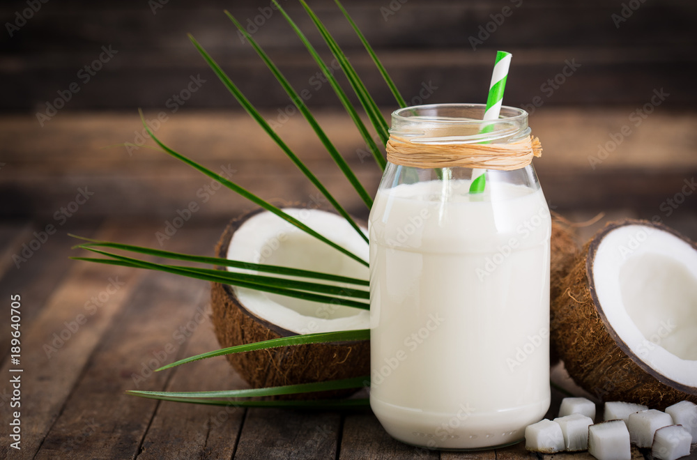 Coconut milk in the glass jar Coconut milk in the glass jar