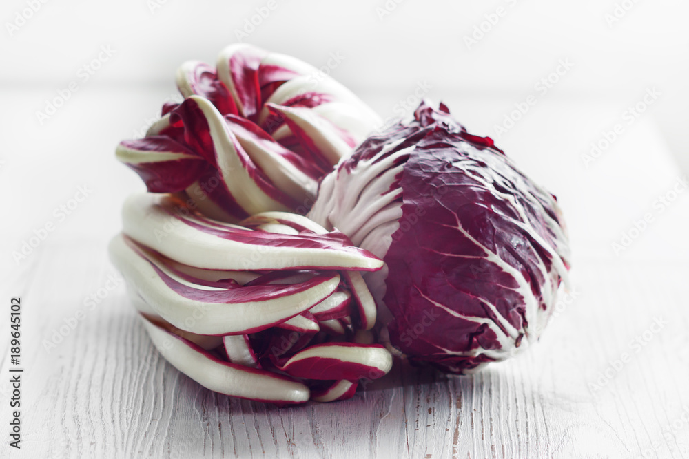 Fototapeta premium Radicchio of Treviso red chicory on white board.