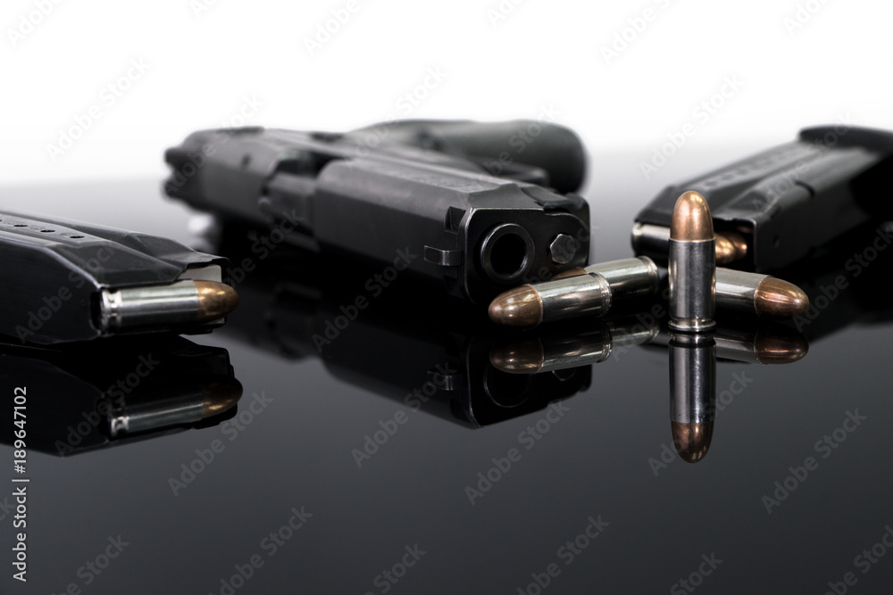 9mm Pistol gun with ammunition, Bullets and magazine on white background. Gun isolated. 9mm Pistol gun with ammunition, Bullets and magazine on white background. Gun isolated.