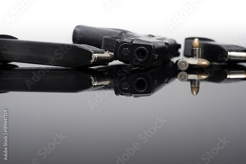 9mm Pistol gun with ammunition, Bullets and magazine on black background. Gun isolated.