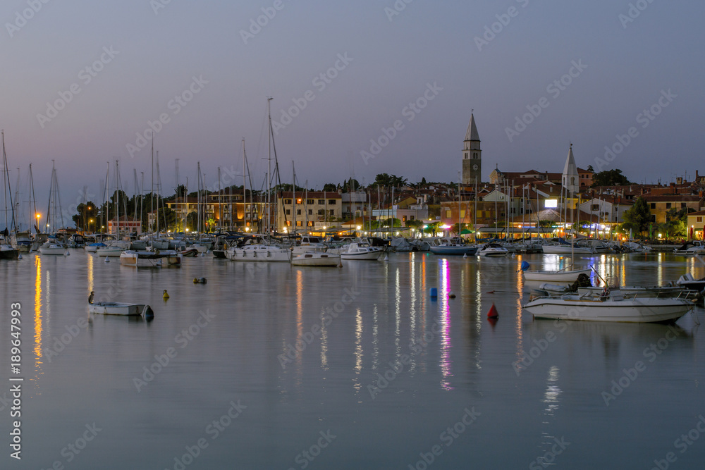Sailboats in the port of Isola. Small town and its marina, located in southwestern Slovenia on the Adriatic coast. Summer vacation. Relaxation Concept.