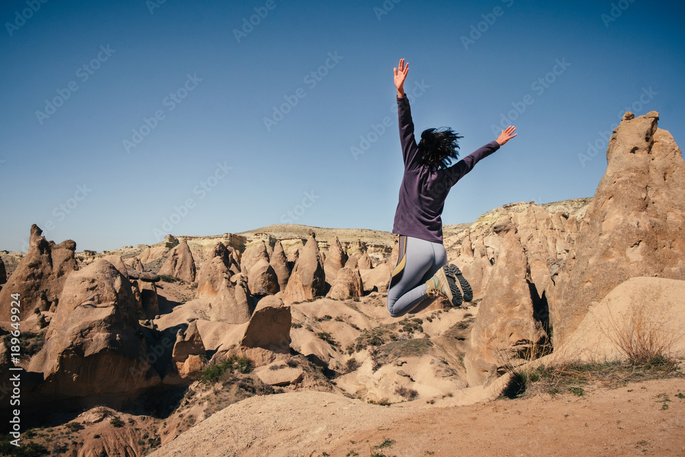 One happy traveler in the desert valley, Cappadocia One happy traveler in the desert valley, Cappadocia