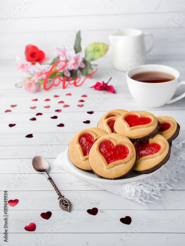 Homemade Cookies with a Red Jam Heart Valentine's Day Cup of tea photo