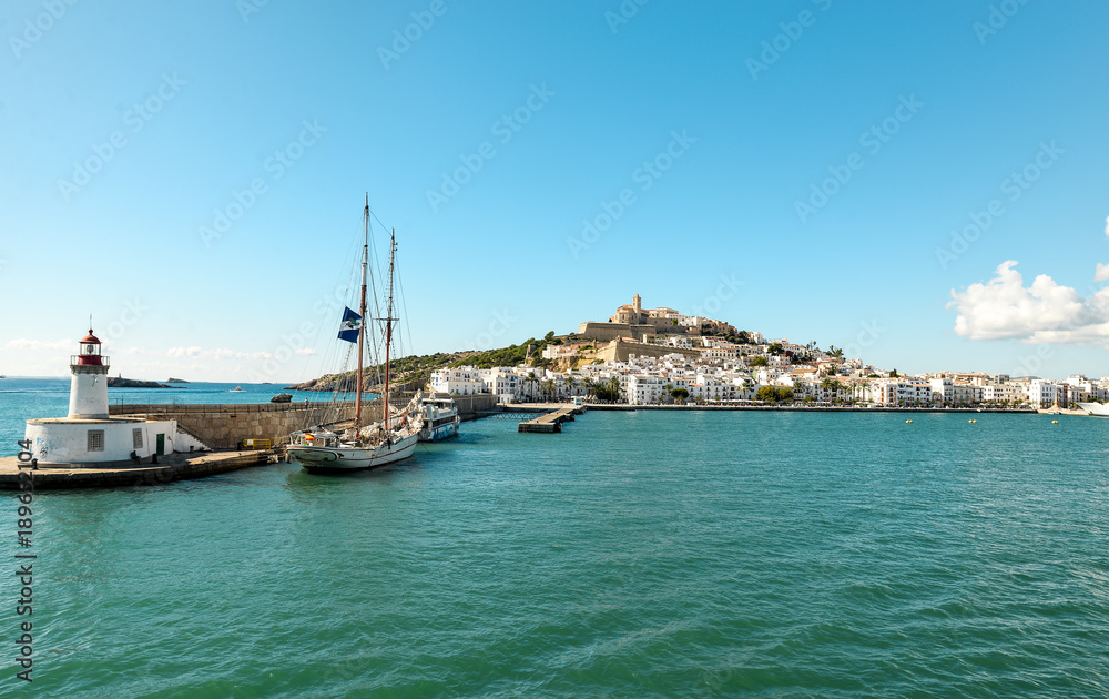 Ibiza, Spain - October 5, 2017 : Beautiful view of boat port and old town of Ibiza city and Formentera islands, Spain. Sea rest and holiday concept. View from boat and water. Popular summer resort.