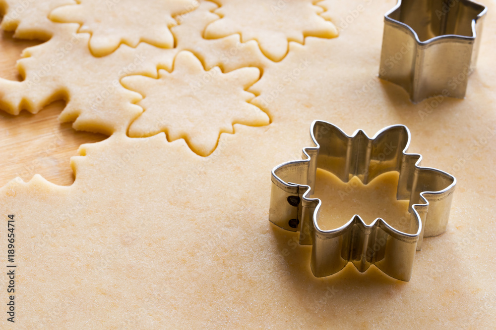 Cutting out star shapes for Linzer Christmas cookies Cutting out star shapes for Linzer Christmas cookies
