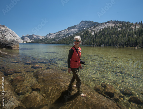 Wading in a Yosemite High Mountain Lake photo