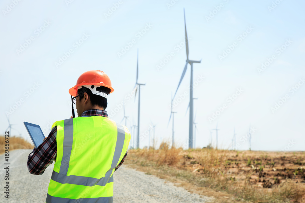 Engineers are investigating the wind turbine. Engineers are investigating the wind turbine.