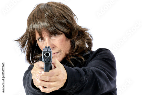 Mature Woman pointing a Gun