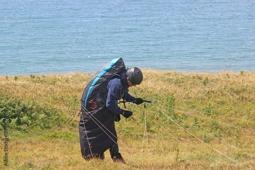 paraglider preparing to launch