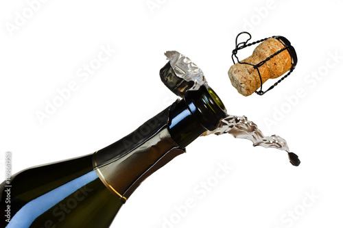 Fotografie a bottle of champagne and a departing cork isolated on a white background