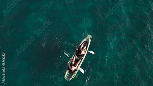 Photography Aerial view of two kayaker peddling on the sea