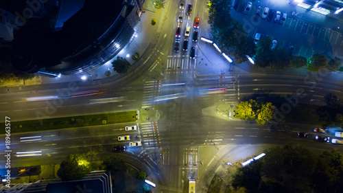 Night aerial view of a intersection at rushour . drone street view photo