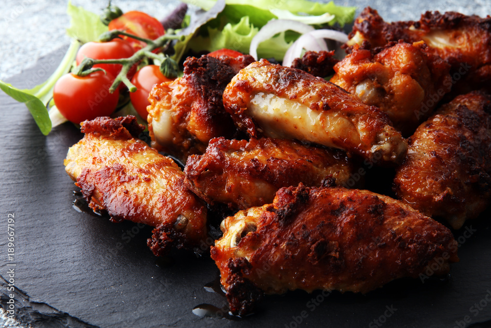 crispy barbecue chicken wings bbq on grey background