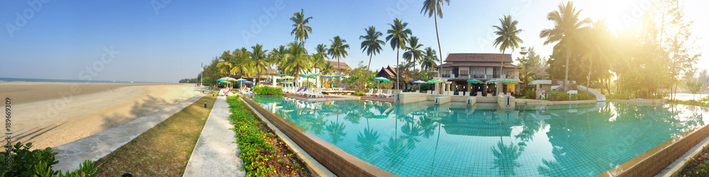 The pool on the seashore in tropical plants
