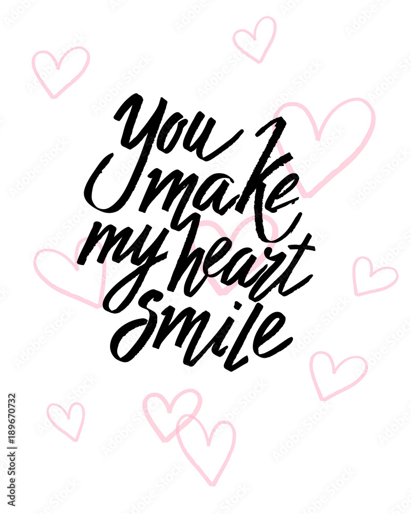 You make my heart smile Valentines day calligraphy card. Hand drawn design elements. Handwritten modern brush lettering.