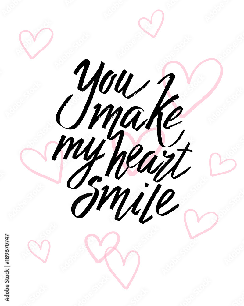 You make my heart smile Valentines day calligraphy card. Hand drawn design elements. Handwritten modern brush lettering.