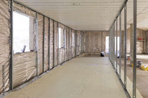 Building construction: insulation of a house with thermal reflective material photo