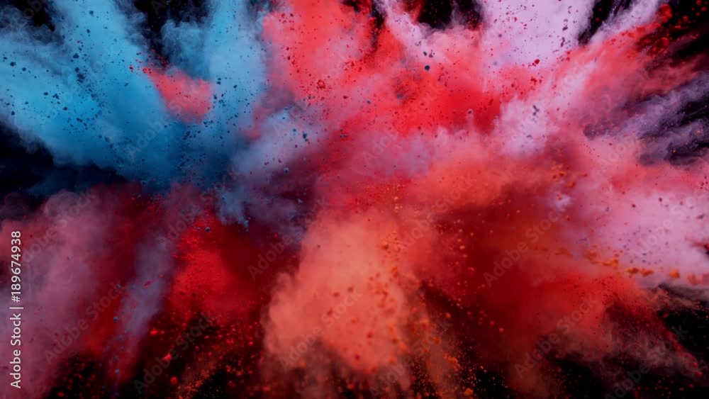 
Colorful powder/particles fly after being exploded against black background. Shot with high speed camera, phantom flex 4K. Slow Motion.