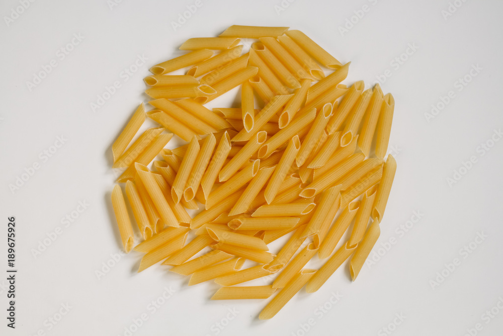 Dried rigatoni pasta on white background Dried rigatoni pasta on white background