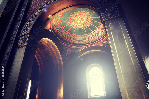 Munich, interior of St. Louis University church - Ludwigskirche built in XIX century in Neo-Romanesque style, view of the painted ceiling and the round arches photo