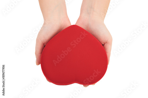 hands holding bright red heart on white background top view